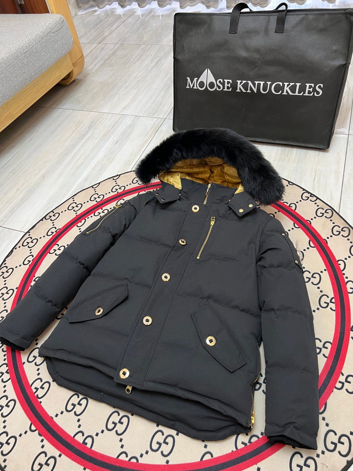 Moose Knuckles Men's Black Hooded Puffer Jacket with Gold-Tone Details
