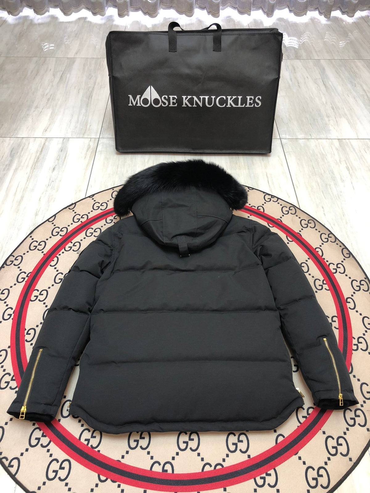 Moose Knuckles Men's Black Hooded Puffer Jacket with Gold-Tone Details