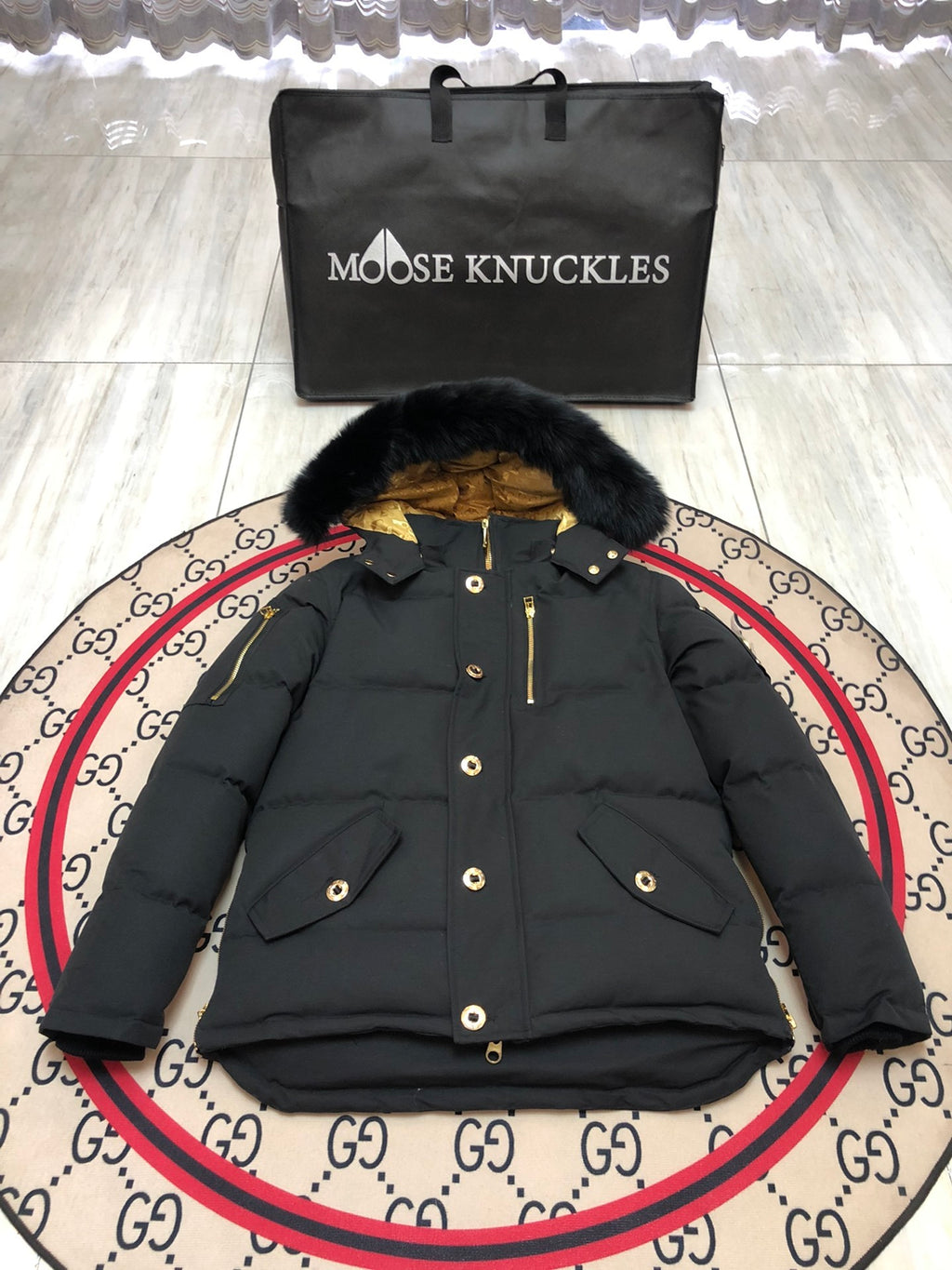 Moose Knuckles Men's Black Hooded Puffer Jacket with Gold-Tone Details