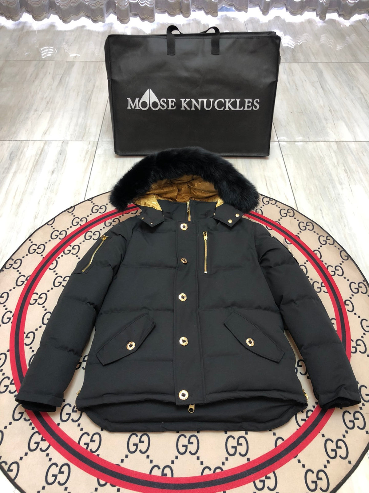 Moose Knuckles Men's Black Hooded Puffer Jacket with Gold-Tone Details