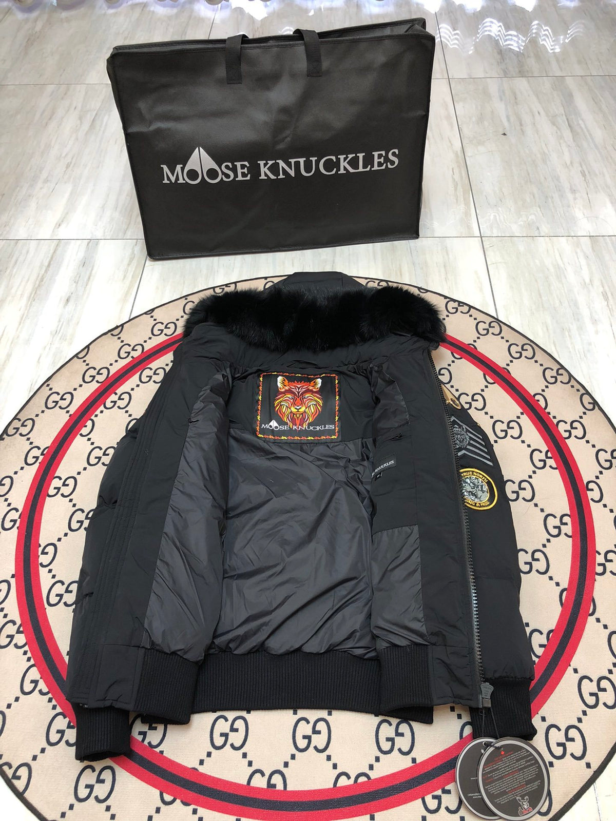Moose Knuckles Unisex Black Hooded Bomber Jacket with Graphic Patches